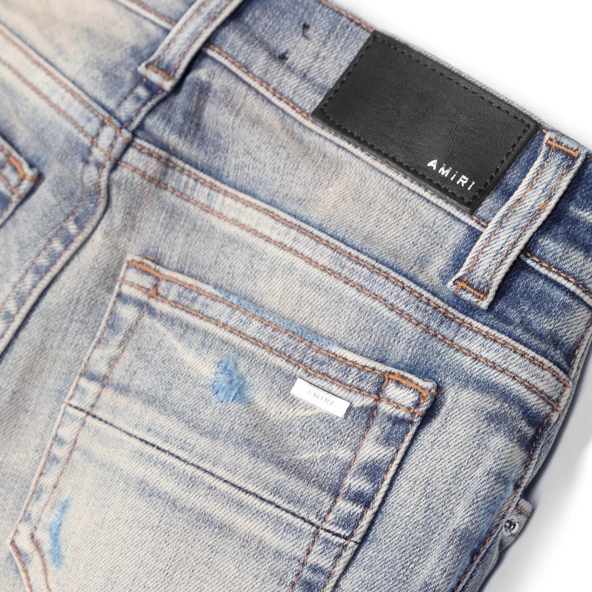 Back pocket view of Amiri Kids MX1 Clay Indigo Jeans PF22KDS034-408